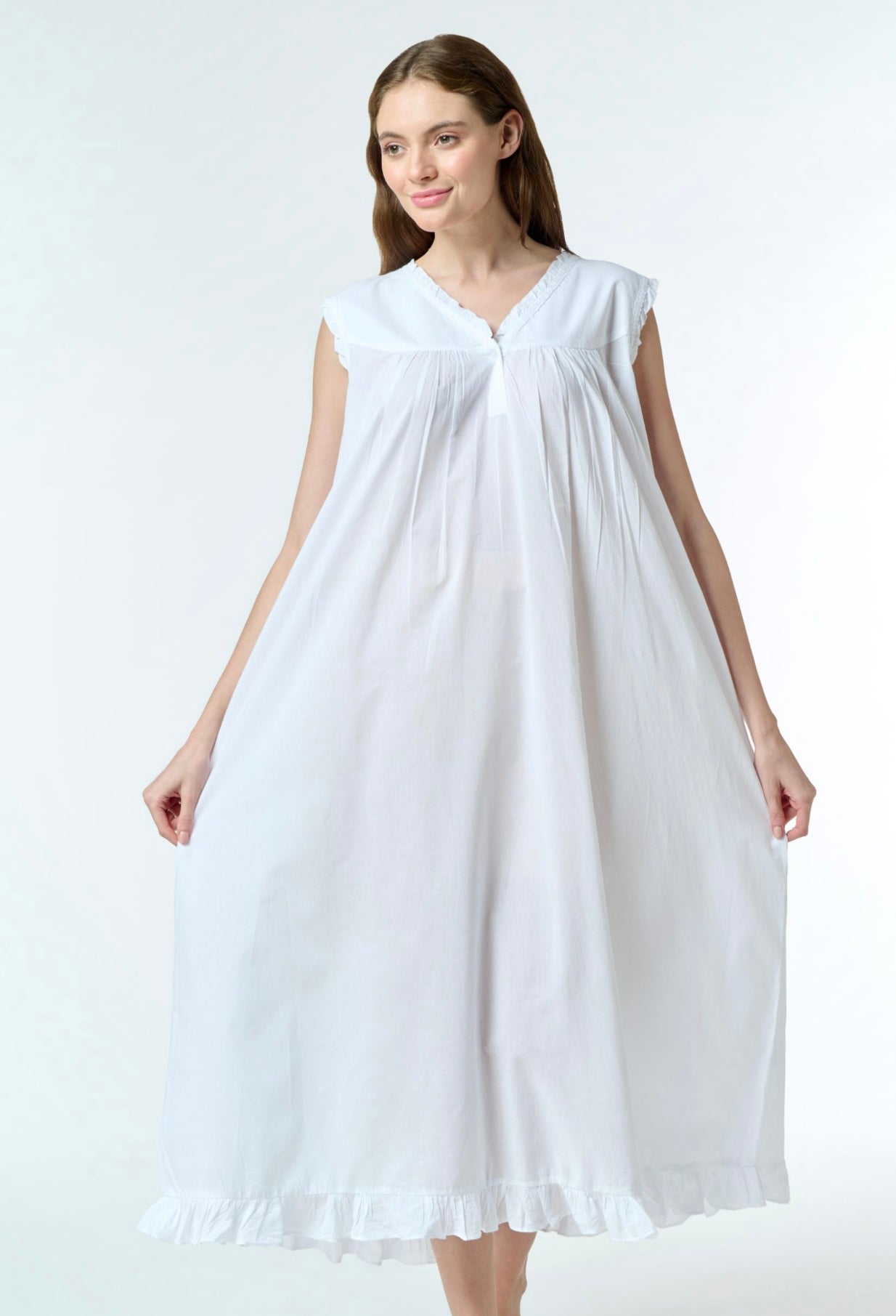 Woman wearing capped sleeve white cotton nightdress with white background