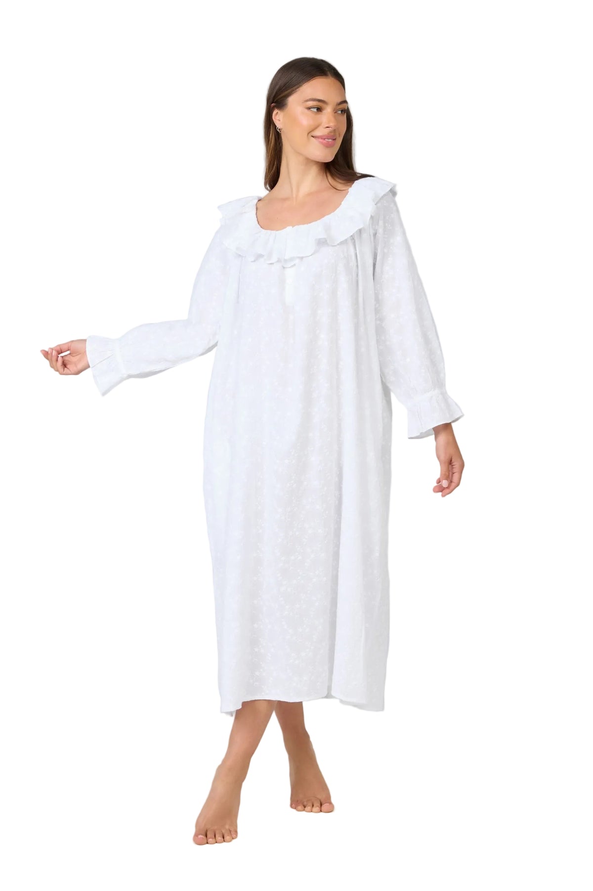 Woman wearing a white nightgown on a plain background