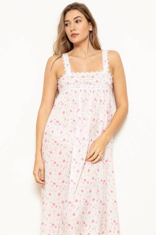 Woman wearing pretty long floral pink & white nightie