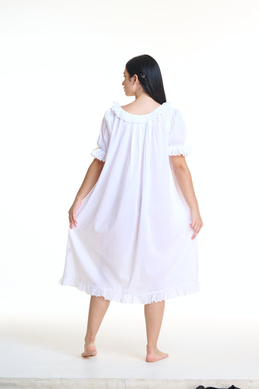 Vintage Style Arabella White Short Sleeve Nightie with frill on hem, sleeves and neckline. This nightie has pockets as well as Pin tuck detail across yolk and buttons down the front of the gown.