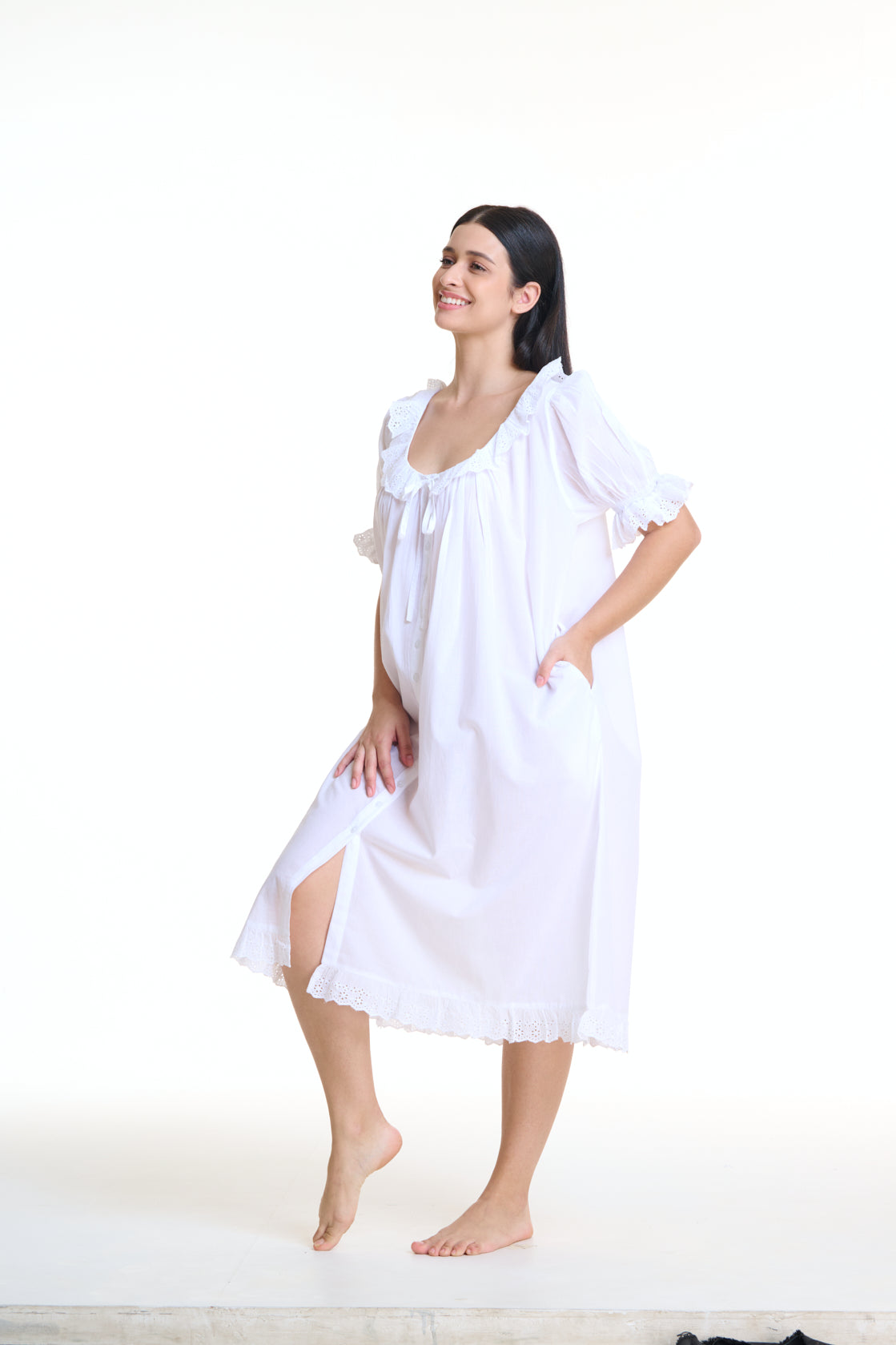 Vintage Style Arabella White Short Sleeve Nightie with frill on hem, sleeves and neckline. This nightie has pockets as well as Pin tuck detail across yolk and buttons down the front of the gown. 