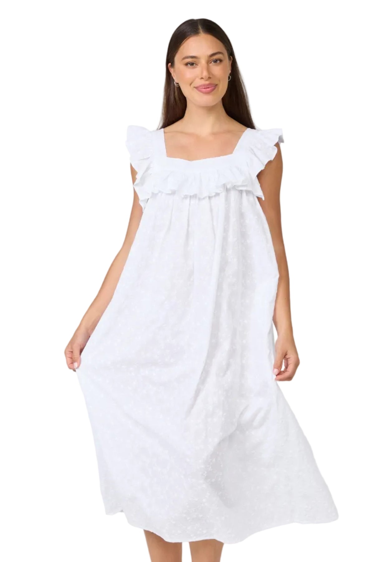 A woman modeling a white midi-length nightgown with ruffled shoulder straps and a square neckline, photographed against a plain light gray studio background.