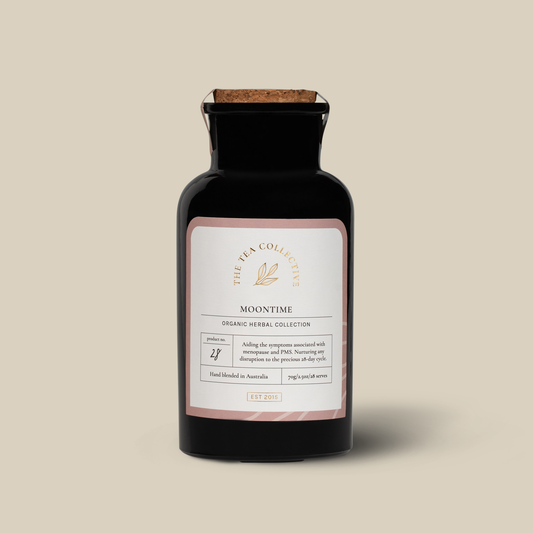 Black Bottle with cork lid labelled Moontime by The Tea Collective