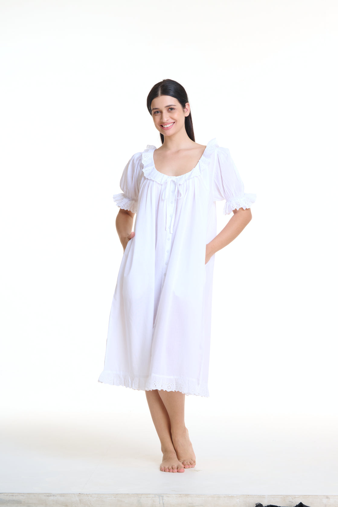 Vintage Style Arabella White Short Sleeve Nightie with frill on hem, sleeves and neckline. This nightie has pockets as well as Pin tuck detail across yolk and buttons down the front of the gown. 