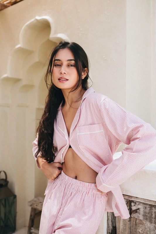 Charming Pink pinstripe PJ set. Lightweight cotton long sleeved top with breast pocket and long matching wide leg pants with elastic waistband.