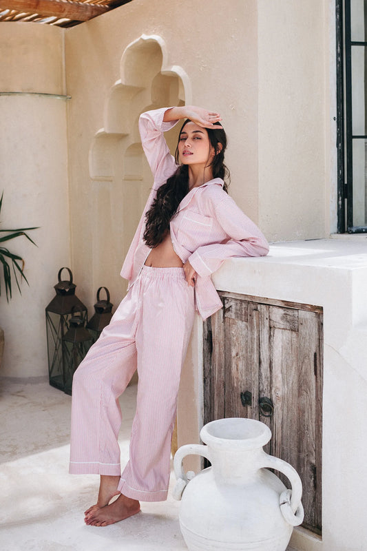 Charming Pink pinstripe PJ set. Lightweight cotton long sleeved top with breast pocket and long matching wide leg pants with elastic waistband.